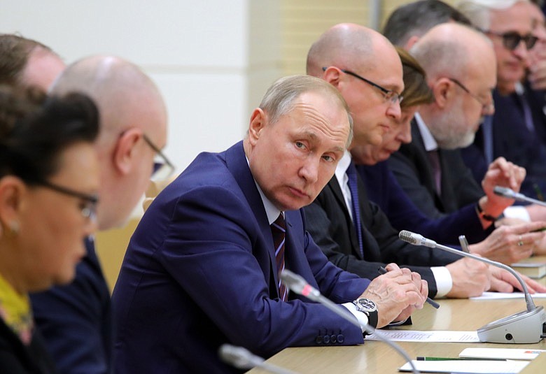 Russian President Vladimir Putin attends a meeting on drafting constitutional changes at the Novo-Ogaryovo residence outside Moscow, Russia, Thursday, Jan. 16, 2020. Putin proposed a set of constitutional amendments that could keep him in power well past the end of his term in 2024.(Mikhail Klimentyev, Sputnik, Kremlin Pool Photo via AP)