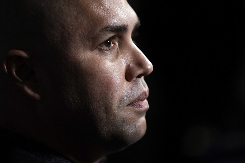 Carlos Beltran listens to a question during baseball's winter meetings in San Diego on Dec. 10. Beltran is out as manager of the New York Mets without having worked a single game, the team announced Thursday. / AP photo by Gregory Bull

