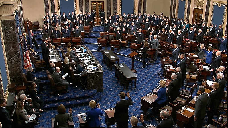 In this image from video, presiding officer Supreme Court Chief Justice John Roberts swears in members of the Senate for the impeachment trial against President Donald Trump at the U.S. Capitol in Washington, Thursday, Jan. 16, 2020. (Senate Television via AP)