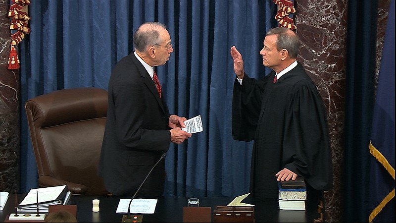 In this image from video, President Pro Tempore of the Senate Sen. Chuck Grassley, R-Iowa., swears in Supreme Court Chief Justice John Roberts as the presiding officer for the impeachment trial of President Donald Trump in the Senate at the U.S. Capitol in Washington, Thursday, Jan. 16, 2020. (Senate Television via AP)