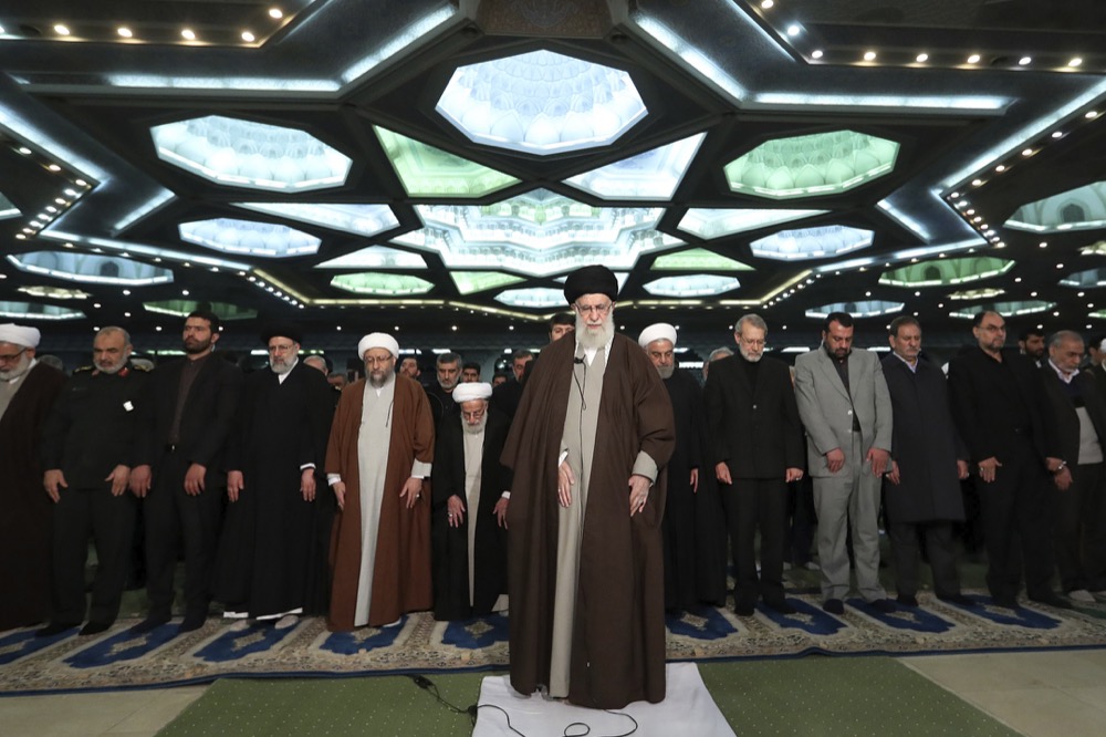 In this picture released by the official website of the office of the Iranian supreme leader, Supreme Leader Ayatollah Ali Khamenei, center, leads the Friday prayers at Imam Khomeini Grand Mosque in Tehran, Iran, Friday, Jan. 17, 2020. Iran's supreme leader said President Donald Trump is a