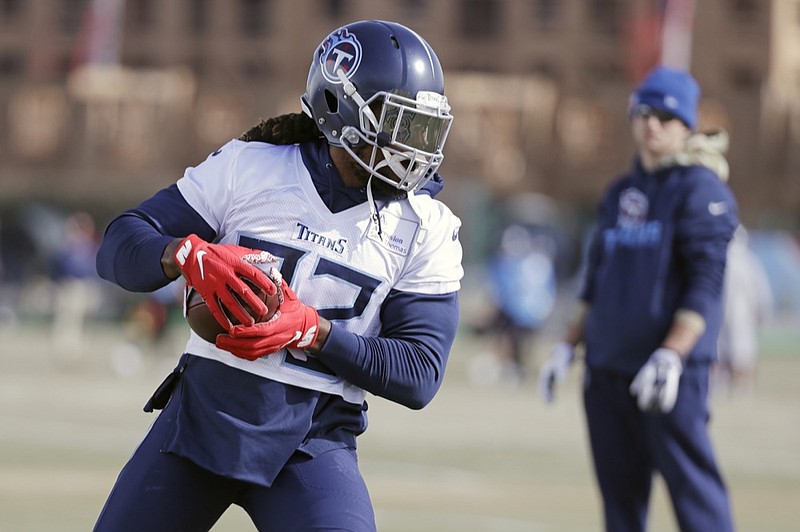 Tennessee Titans running back Derrick Henry goes through a drill during practice Thursday in Nashville. The Titans visit the Kansas City Chiefs with the AFC title on the line Sunday, when the San Francisco 49ers host the Green Bay Packers in the NFC championship game. / AP photo by Mark Humphrey