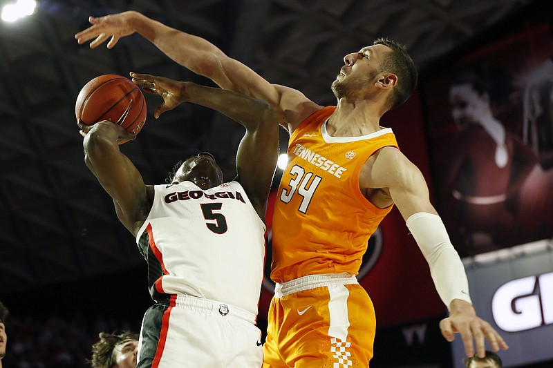Tennessee forward Uros Plavsic blocks a shot by Georgia's Anthony Edwards during the first half Wednesday night in Athens, Ga. / AP photo by Joshua L. Jones