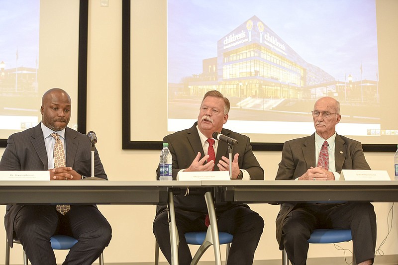 Staff file photo by Tim Barber / Hamiton officials, including School Superintendent Dr. Bryan Johnson, left, County Mayor Jim Coppinger, center, and Sheriff Jim Hammond discuss the wellbeing of children last June in a roundtable at the Children's Kennedy Outpatient Center at Erlanger.