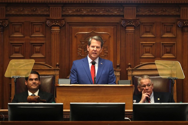 Gov. Brian Kemp, center, is flanked by House Speaker David Ralston, R-Blue Ridge, right, and Lt. Gov. Geoff Duncan as he speaks during the State of the State address before a joint session of the Georgia General Assembly Thursday, Jan. 16, 2020, in Atlanta.(AP Photo/John Bazemore)



