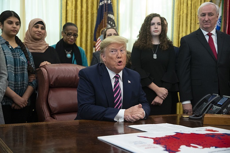 President Donald Trump speaks during an event on prayer in public schools, in the Oval Office of the White House, Thursday, Jan. 16, 2020, in Washington. (AP Photo/ Evan Vucci)