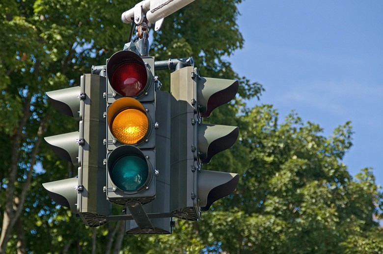Yellow on a traffic signal means to slow down because the light will soon be red. / Getty Images/iStockphoto/suesmith2