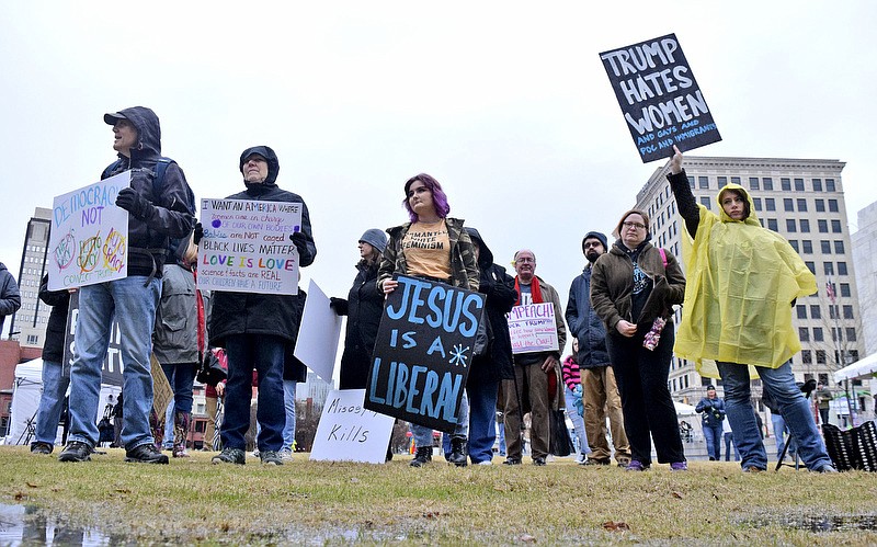 Staff Photo by Robin Rudd/   Protestors stand on the soggy grass of Miller Park.  Chattanooga Women's Rally 2020 was held at Miller Park on January 18, 2020.  The event highlighted the political power and progress of women in the Chattanooga area.  