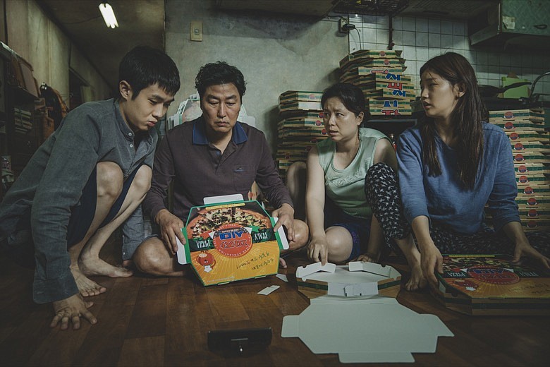 This image released by Neon shows Woo-sik Choi, from left, Kang-ho Song, Hye-jin Jang and So-dam Park in a scene from "Parasite." The film was nominated for an Oscar for best feature film and also one for best international feature film of the year. (Neon via AP)