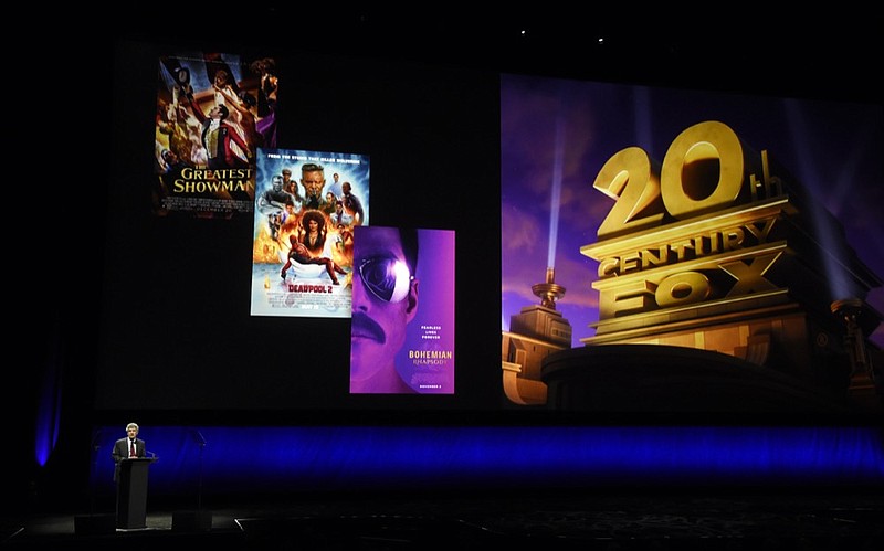 FILE - In this April 3, 2019, file photo, Alan Horn, chairman of The Walt Disney Studios, speaks underneath poster images for 20th Century Fox films during the Walt Disney Studios Motion Pictures presentation at CinemaCon 2019, the official convention of the National Association of Theatre Owners (NATO) at Caesars Palace in Las Vegas. (Photo by Chris Pizzello/Invision/AP, File)


