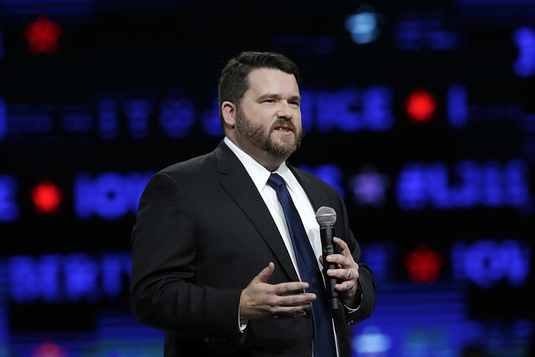 In this Nov. 1, 2019, file photo, Iowa Democratic Party Chair Troy Price speaks during the Iowa Democratic Party's Liberty and Justice Celebration in Des Moines, Iowa. Two of the first three states to vote in the Democratic presidential race will use new mobile apps to gather results from thousands of caucus sites. The technology is intended to make counting easier, but that raises concerns of hacking or glitches. (AP Photo/Nati Harnik, File)