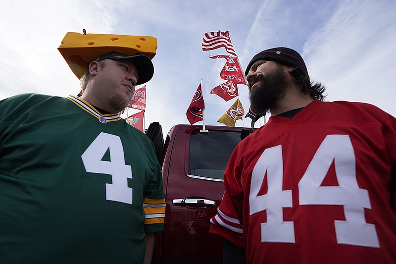 Fans tailgate at Levi's Stadium in Santa Clara, Calif., on Sunday afternoon ahead of the San Francisco 49ers hosting the Green Bay Packers in the NFC title game. / AP photo by Tony Avelar