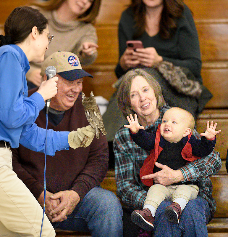 Staff Photo by Robin Rudd/ Little Apollo Hicks is delighted by a eastern screech owl carried by Beth Parker, of the American Eagle Foundation at the Birchwood Community Center. Holding Apollo is grandmother Nancy Ponder. Looking on is grandfather Erie Ponder. The 29th Annual Tennessee Sandhill Crane Festival celebrates the thousands of birds that migrate through or spend the winter on and around the Hiwassee Refuge. The festival, the final day was January 19, 2020, also provides an opportunity to focus on the rich wildlife heritage of the state and the Native American history of the area.
