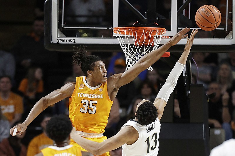 Tennessee guard Yves Pons (35) blocks a shot by Vanderbilt forward Matthew Moyer during the first half of their teams' SEC game Saturday night in Nashville. / AP photo by Mark Humphrey
