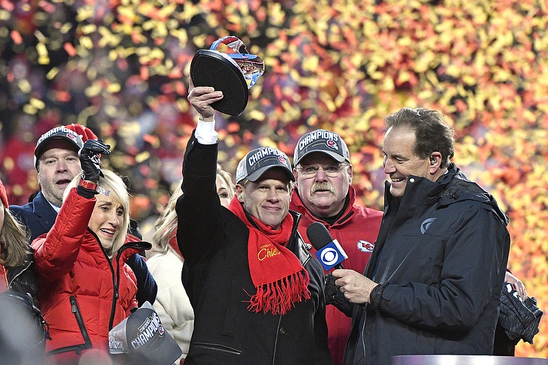 Norma Hunt, left, and her son Clark Hunt, center, owners of the Kansas City Chiefs, and coach Andy Reid, second from right, celebrate after the team beat the Tennessee Titans in Sunday's AFC title game to advance to Super Bowl LIV. / AP photo by Jeff Roberson