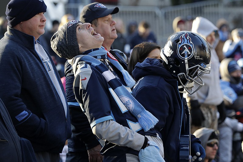 Tennessee Titans fan Justin Newman, front center, reacts to a call that went against the team at an outdoor viewing party in downtown Nashville on Sunday during the Titans' 35-24 loss at Kansas City in the AFC title game. / AP photo by Mark Humphrey