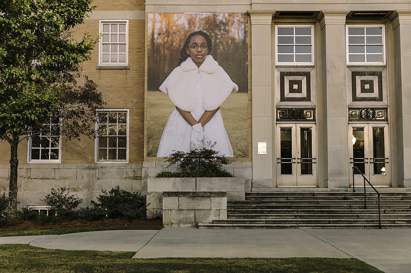 A banner portrait of local resident Ariel McCullough is displayed on the exterior of a building near downtown as part of photographer Mary Beth Meehan's "Seeing Newnan" art installation project in Newnan, Ga., Nov. 1, 2019. The small Southern city decided to use art to help the community celebrate diversity and embrace change, but not everyone was ready for what they saw. (William Widmer/The New York Times)