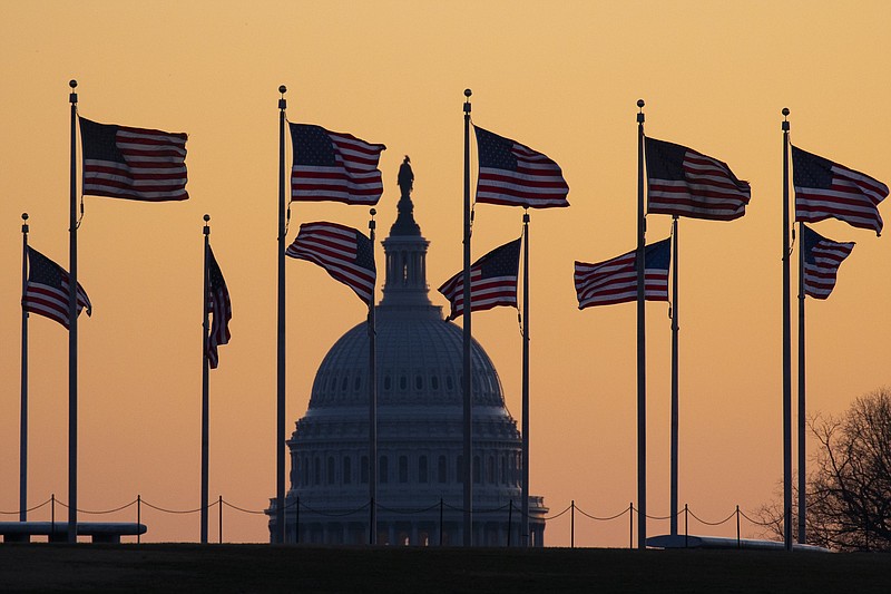 Photo by Jon Elswick of The Associated Press / The U.S. Capitol at sunrise on Monday in Washington.