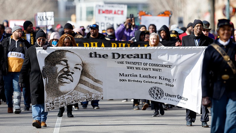 Staff photo by C.B. Schmelter / People take part in a memorial march along M.L. King Boulevard on Monday, Jan. 20, 2020 in Chattanooga, Tenn. The memorial march was part of the Unity Group of Chattanooga's 50th annual Martin Luther King Jr. Week celebration