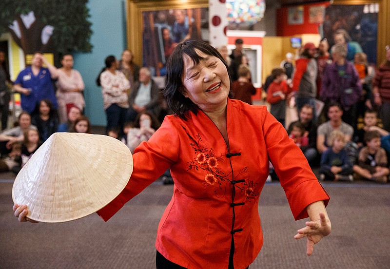 Staff file photo / Bihua Liu with the Chattanooga Chinese Association performs a cloud chasing the moon dance during last year's Chinese New Year celebration at the Creative Discovery Museum. This year's celebration is set for the final day of Chinese New Year, Saturday, Feb. 8.
