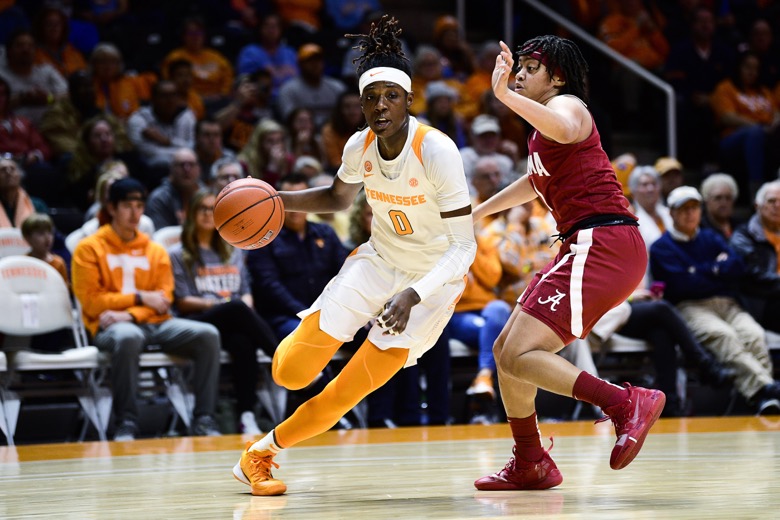 Tennessee guard/forward Rennia Davis (0) dribbles around Alabama guard Megan Abrams (1) during a game at Thompson-Boling Arena in Knoxville, Tenn. on Monday, Jan. 20, 2020. Tennessee defeated Alabama 65-63. (Calvin Mattheis/Knoxville News Sentinel via AP)
