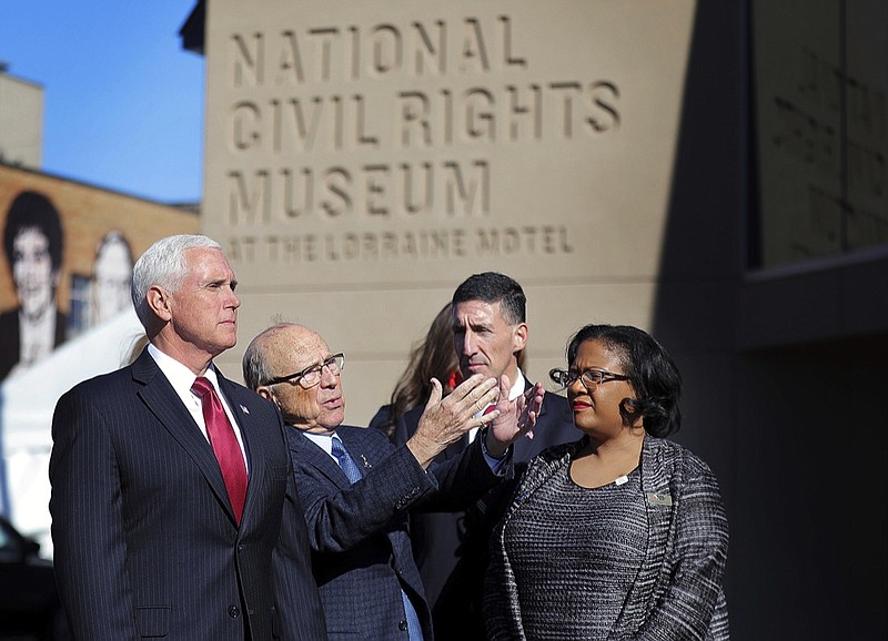 Vice President Mike Pence, left, listens to the history of the Civil Rights Museum during a visit, Sunday, Jan. 19, 2020, to Memphis, Tenn., on the eve of Dr. Martin Luther King Jr. Day. (Patrick Lantrip/Daily Memphian via AP)