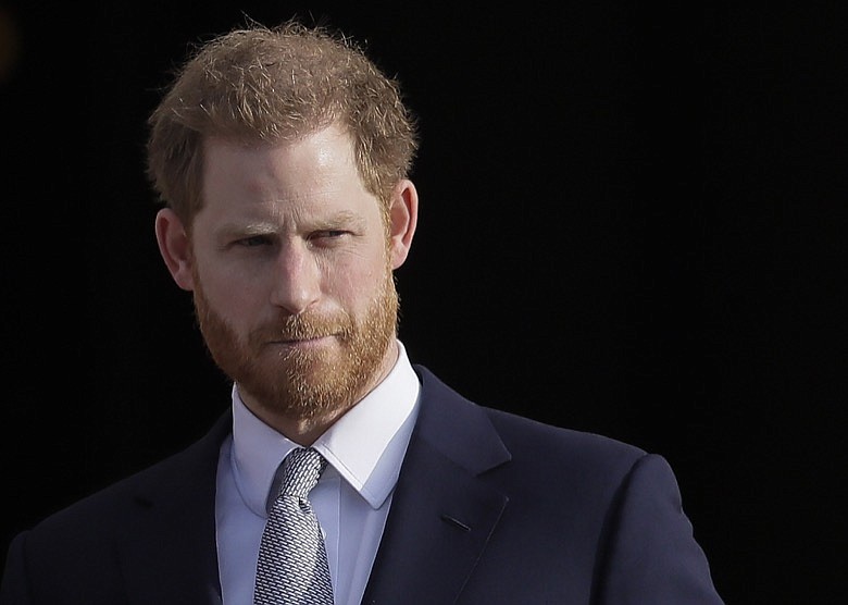 In this Thursday, Jan. 16, 2020, file photo, Britain's Prince Harry arrives in the gardens of Buckingham Palace in London. Prince Harry said Sunday, Jan. 19 that he felt "great sadness" but found "no other option" to cutting almost all of his and his wife Meghan's royal ties in the hopes of achieving a more peaceful life. (AP Photo/Kirsty Wigglesworth, File)