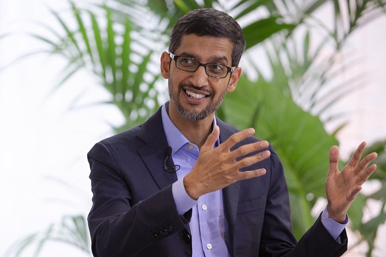 Google's chief executive Sundar Pichai addresses the audience during an event on artificial intelligence at the Square in Brussels, Monday, Jan. 20, 2020. Google's chief executive called Monday for a balanced approach to regulating artificial intelligence, telling a European audience that the technology brings benefits but also negative consequences. (AP Photo/Virginia Mayo)