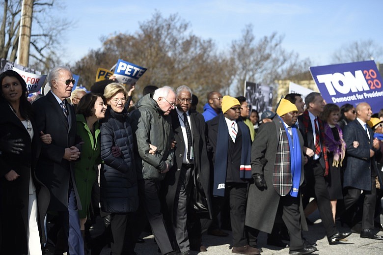 Most of the Democrats seeking their party's presidential nomination march in a Martin Luther King Jr. Day rally on Monday, Jan. 20, 2020, in Columbia, S.C. (AP Photo/Meg Kinnard)