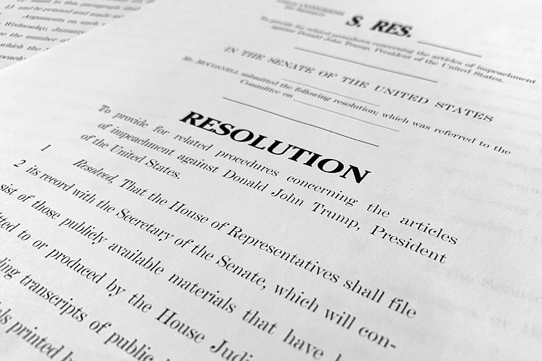 A copy of a Senate draft resolution to be offered by Senate Majority Leader Mitch McConnell, R-Ky., regarding the procedures during the impeachment trial of President Donald Trump in the U.S. Senate is photographed in Washington, Monday, Jan. 20, 2020. McConnell is proposing a condensed, two-day calendar for opening arguments in Trump's impeachment trial, ground rules that are raising objections from Democrats on the eve of the landmark proceedings. (AP Photo/Jon Elswick)