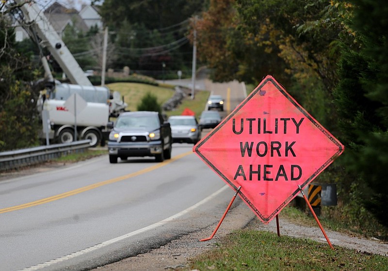 A sign indicates work being done along in the 7600 block of Snow Hill Road Friday, November 2, 2018 in Ooltewah, Tennessee. Water and Wastewater Treatment Authority workers were clearing a stand pipe at the Snow Hill pump station Friday after clogs caused a massive sewer overflow last weekend. / Staff photo by Erin O. Smith 