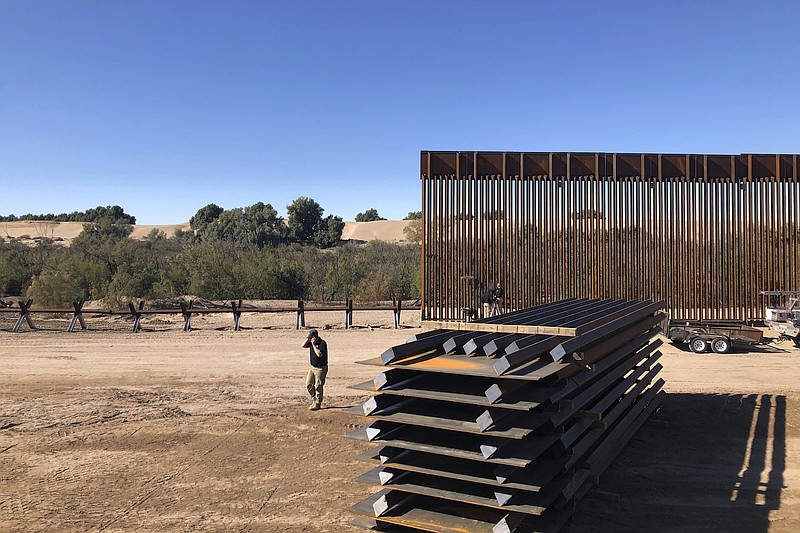 Photo by Elliot Spagat of The Associated Press / This Jan. 10, 2020, photo shows a portion of border wall under construction in Yuma, Arizona. Illegal border crossings have plummeted as the Trump administration has extended a policy to make asylum seekers wait in Mexico for court hearings in the U.S.