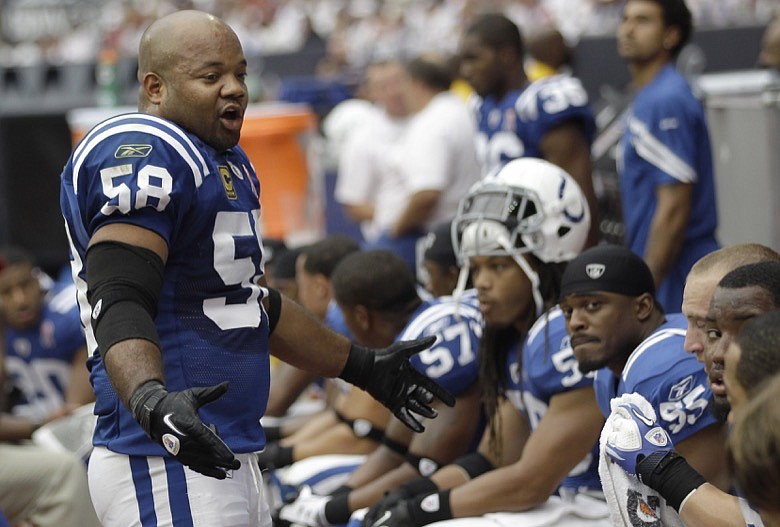 Indianapolis Colts linebacker Gary Brackett (58) talks to his teammates during the second quarter of an NFL football game against the Houston Texans on Sunday, Sept. 11, 2011, in Houston. (AP Photo/David J. Phillip)