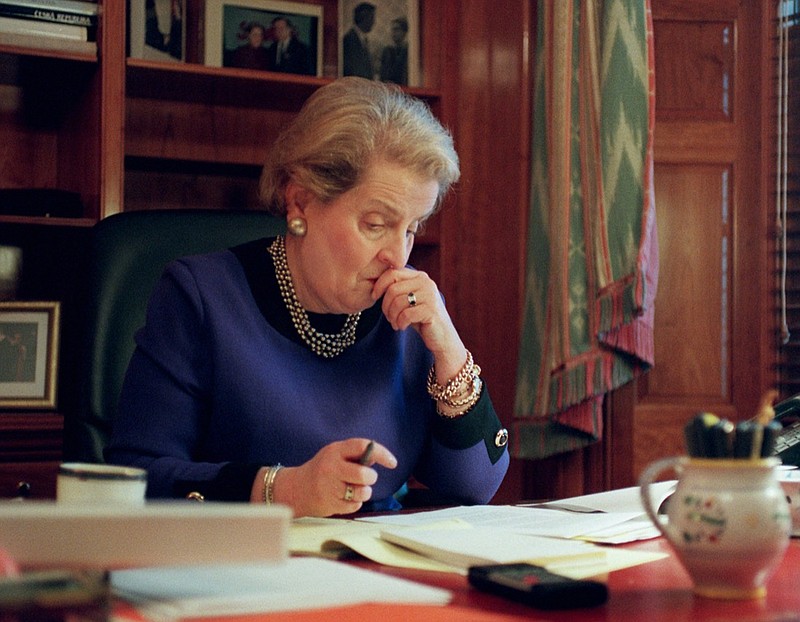 Secretary of State Madeleine Albright gets to work in her State Department office in Washington Friday, Jan. 24, 1997. Albright was sworn in at the White House Thursday, becoming the first female secretary of state. (AP Photo/Dennis Cook)