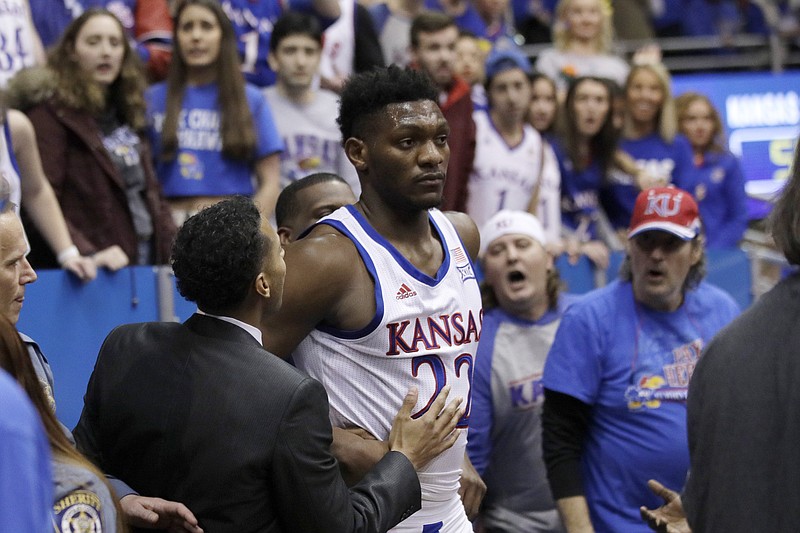 Kansas forward Silvio De Sousa walks out of the crowd after a brawl near the end of Tuesday night's 81-60 home win against Kansas State in Lawrence. Kansas hosts Tennessee on Saturday. / AP photo by Orlin Wagner