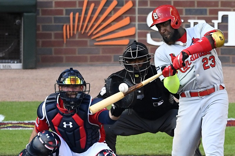 FILE - In this Friday, Oct. 4, 2019 file photo, St. Louis Cardinals left fielder Marcell Ozuna (23) hits a single against the Atlanta Braves in the fourth inning during Game 2 of a best-of-five National League Division Series in Atlanta. (AP Photo/Scott Cunningham, File)


