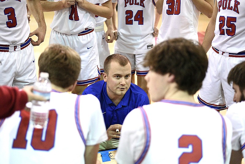 Polk County coach Jon Tucker instructs the Wildcats between quarters in Monday's game against Tellico Plains. Polk County is 15-3 overall. / Staff photo by Robin Rudd