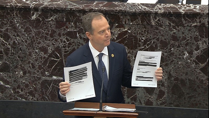 Photo from Senate Television via The Associated Press / House impeachment manager Rep. Adam Schiff, D-California, holds redacted documents as he speaks during the impeachment trial against President Donald Trump in the Senate at the U.S. Capitol in Washington on Wednesday.