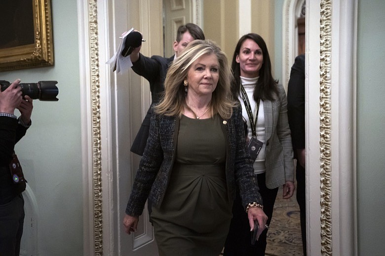 Sen. Marsha Blackburn, R-Tenn., arrives at the Senate for the start of the impeachment trial of President Donald Trump on charges of abuse of power and obstruction of Congress, at the Capitol in Washington, Tuesday, Jan. 21, 2020. (AP Photo/J. Scott Applewhite)