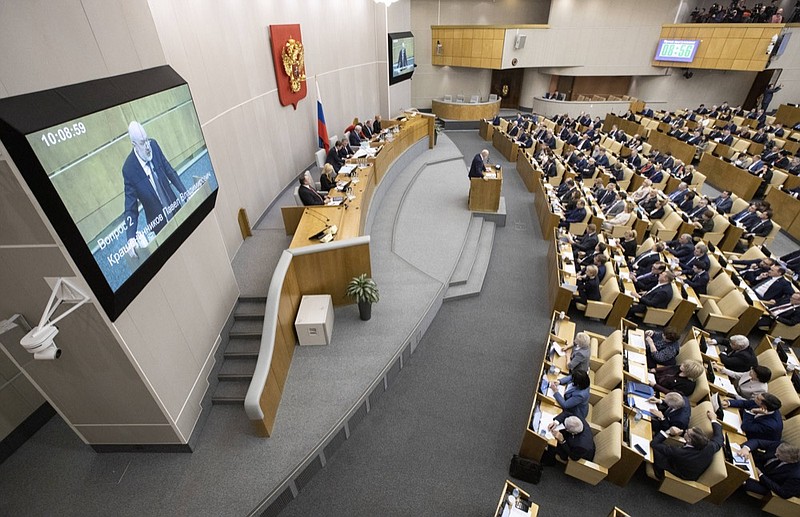 Pavel Krasheninnikov, lawmaker and co-chair of the constitutional reform working group, background center, speaks during a session at the Russian State Duma, the Lower House of the Russian Parliamentin Moscow, Russia, Thursday, Jan. 23, 2020. The Russian lower house of parliament, the State Duma, holds the first of three readings and a vote on a draft bill on constitutional proposals put forward by the Kremlin. (AP Photo/Alexander Zemlianichenko)


