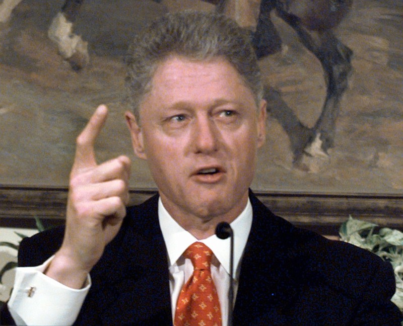 President Clinton angrily shakes his finger as he denies any improper behavior with an intern; Clinton spoke at a White House event on after-school child care Monday, Jan. 26, 1998, in the Roosevelt Room. "I did not have sexual relations with that woman," Clinton said. "I never told anybody to lie." (AP Photo/Greg Gibson)