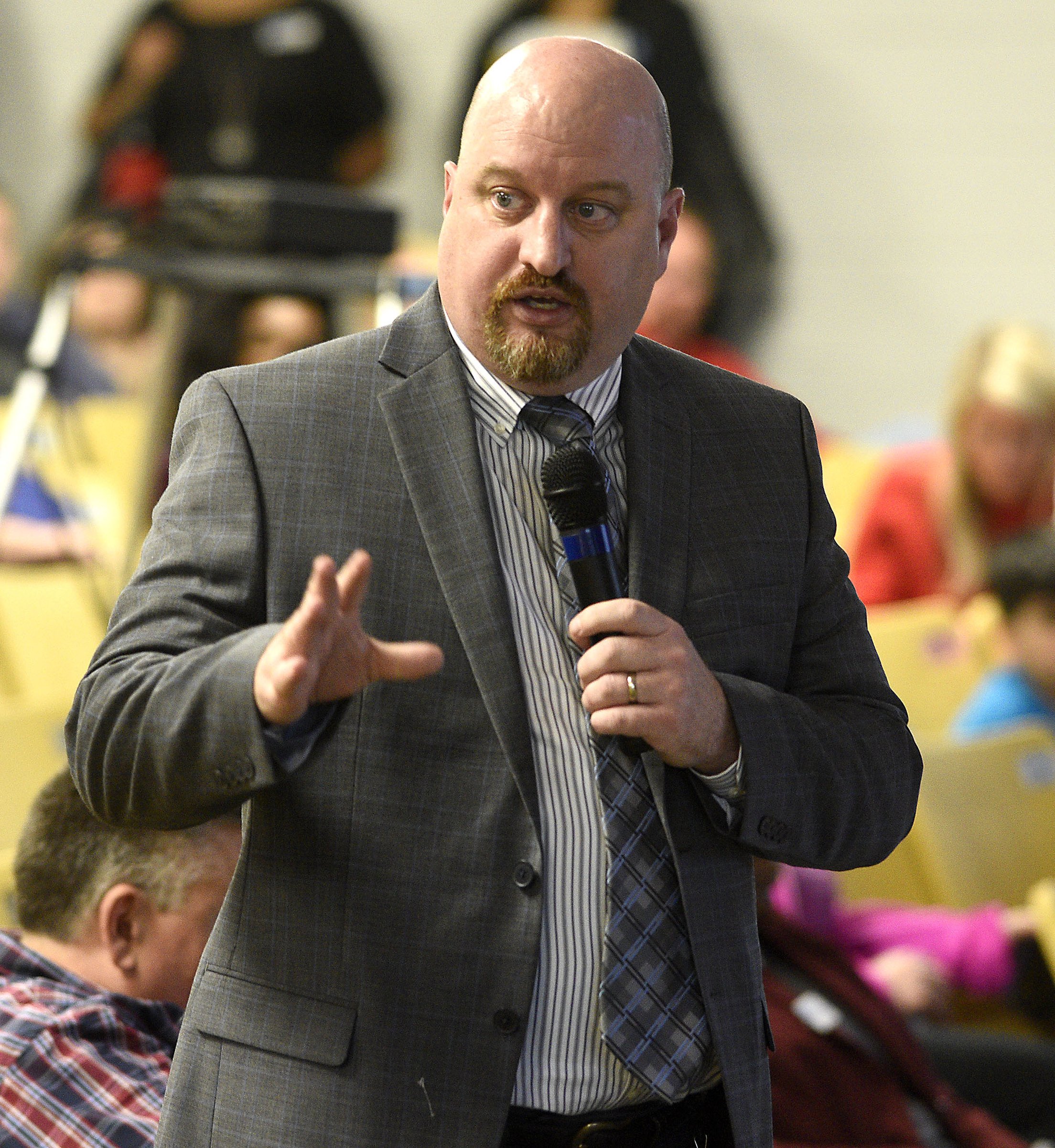 Staff Photo by Robin Rudd/ Hamilton County Schools Director of Informational Technology Ben Coulter answers a question. The conversation about rezoning some of Hamilton County Schoolsՠattendance zones began with a meeting to discuss the East Hamilton/Ooltewah rezoning at Ooltewah Middle School Tuesday night. This is the first of three such meetings.