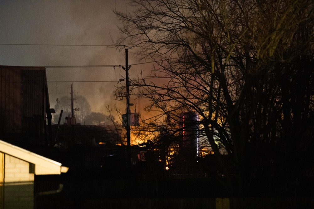 Flames fill the sky after a massive explosion rocks west Houston Friday, Jan. 24, 2020, in Houston.  A massive explosion early Friday leveled a warehouse in Houston and damaged nearby buildings and homes, rousing frightened people from their sleep miles away.  (Marie D. De Jesús/Houston Chronicle via AP)