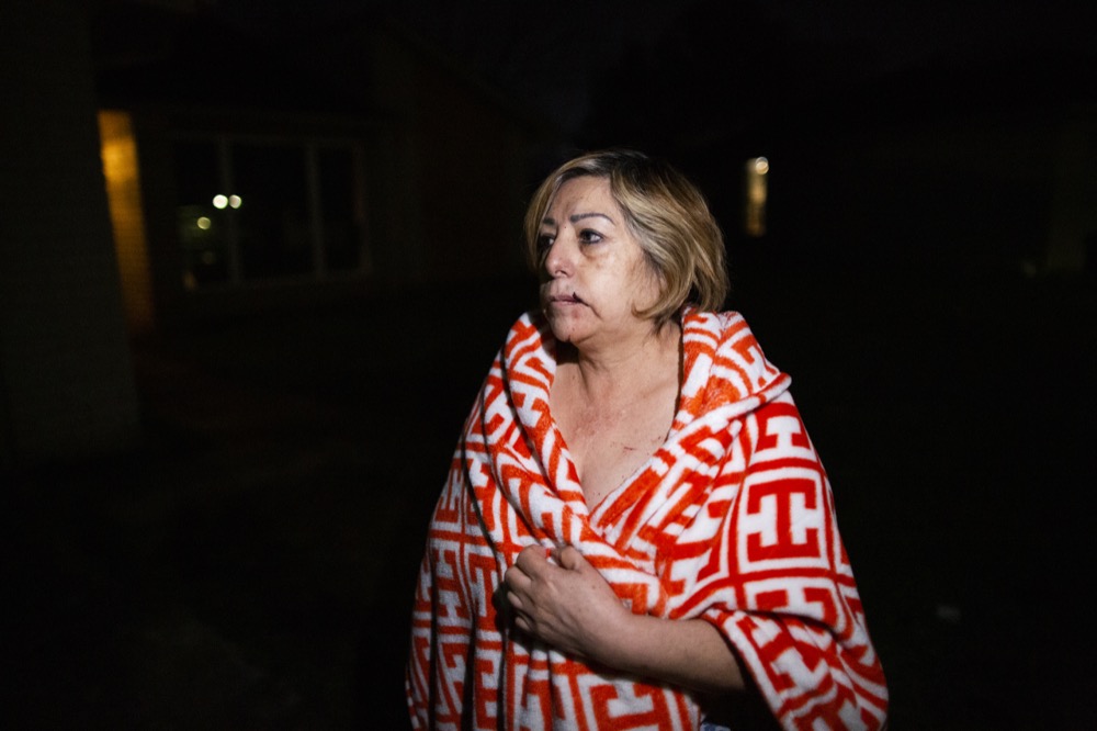 Maria Olivo, a west Houston resident, is shown after a massive explosion blew the window in the room she was sleeping in on Friday, Jan. 24, 2020, in Houston. A massive explosion early Friday leveled a warehouse in Houston and damaged nearby buildings and homes, rousing frightened people from their sleep miles away.  (Marie D. De Jesús/Houston Chronicle via AP)