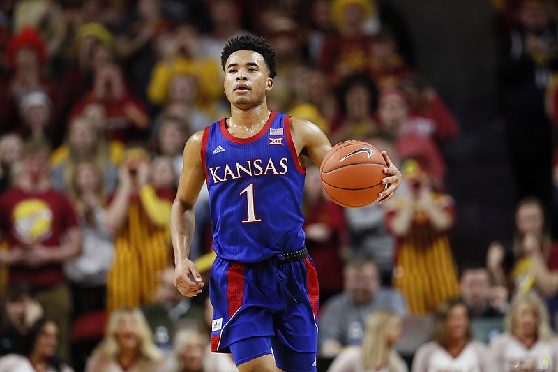 Kansas guard Devon Dotson takes the ball up the court during the first half of a Big 12 game at Iowa State on Jan. 8. / AP photo by Charlie Neibergall