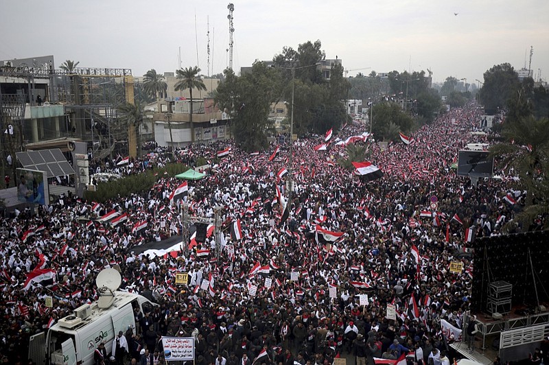 Followers of Shiite cleric Muqtada al-Sadr gather in Baghdad, Iraq, Friday, Jan. 24, 2020. Thousands of supporters of an influential, radical Shiite cleric gathered Friday in central Baghdad for a rally to demand that American troops leave the country amid heightened anti-US sentiment after a drone strike ordered by Washington earlier this month killed a top Iranian general in the Iraqi capital. (AP Photo)

