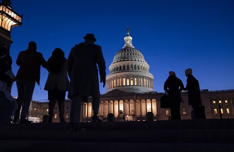 FILE - In this Jan. 22, 2020 file photo, night falls on the Capitol, in Washington. (AP Photo/J. Scott Applewhite, File)


