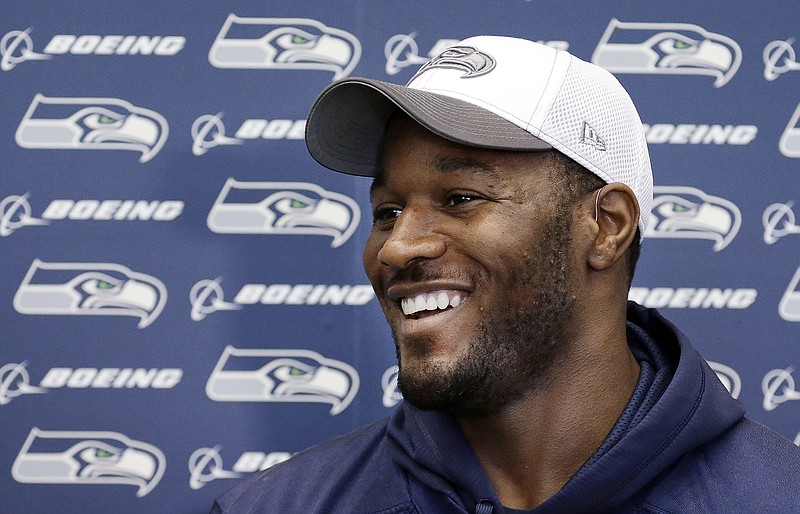 Seattle Seahawks fullback Derrick Coleman speaks with reporters before a team practice for the NFC championship game against the San Francisco 49ers in January 2014. Although not picked in the 2012 NFL draft after completing his career at UCLA, Coleman eventually signed with the Seahawks and played four seasons with them before spending 2017 with the Atlanta Falcons and 2018 with the Arizona Cardinals. / AP photo by Elaine Thompson