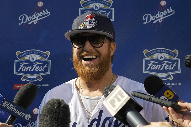 Los Angeles Dodgers third baseman Justin Turner is interviewed by reporters during the team's fan event at its stadium Saturday. / AP photo by Mark J. Terrill