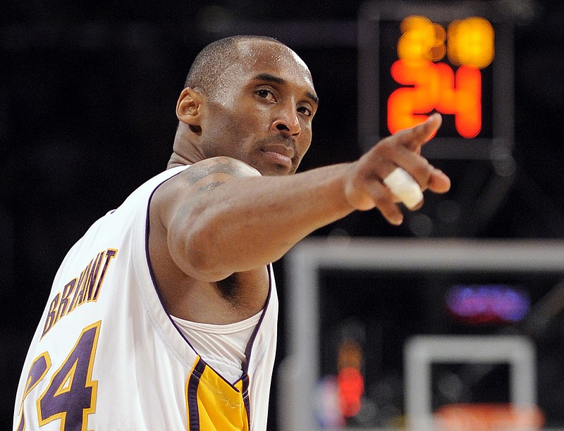 Los Angeles Lakers guard Kobe Bryant points to a player behind him after making a basket in the closing seconds against the Orlando Magic in Game 2 of the NBA Finals on June 7, 2009, in Los Angeles. The Lakers won 101-96. / AP photo by Mark J. Terrill